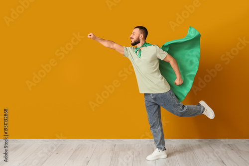 Young man with superhero ca...