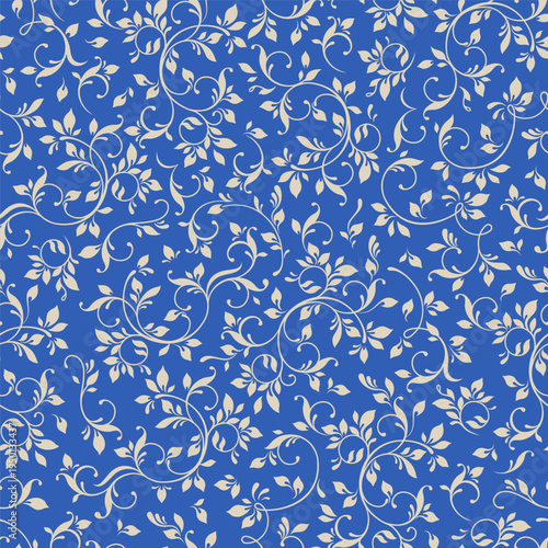 Leaf swirls on  blue background. Seamless pattern.