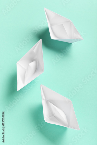 White paper boats on turquo...