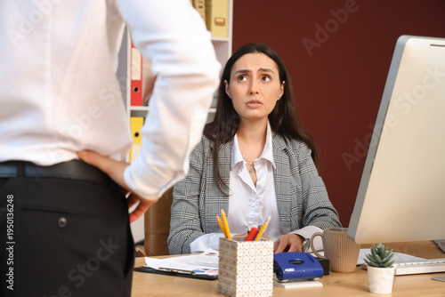 Female worker with angry bo...
