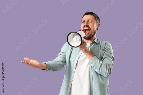 Young man shouting into meg...