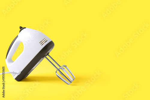 Modern mixer on yellow back...