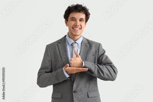 Young businessman using sig...