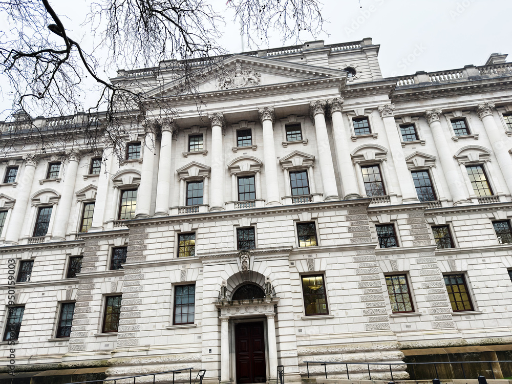 Fototapeta premium Grand white classical building façade in London with tall columns and ornate doorway