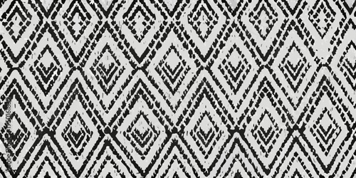 Intricate black and white geometric pattern with repeating diamond shapes