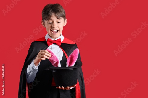 Little magician and hat wit...