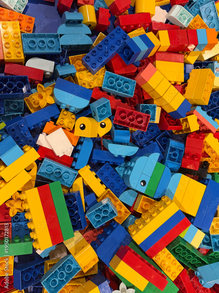 Fototapeta premium Colorful plastic building blocks pile