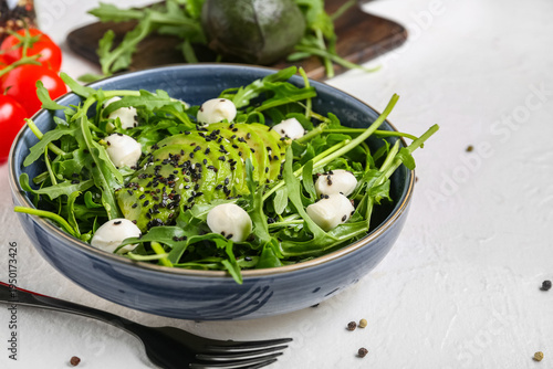 Bowl with tasty arugula sal...