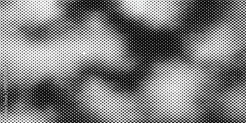 Seamless black carbon fiber mesh and metallic steel grid pattern creates an abstract industrial texture for a modern gray aluminum material surface wallpaper design