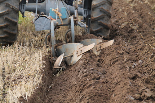 Wallpaper Mural A Vintage Deep Plough Cutting a Furrow in a Farm Field. Torontodigital.ca