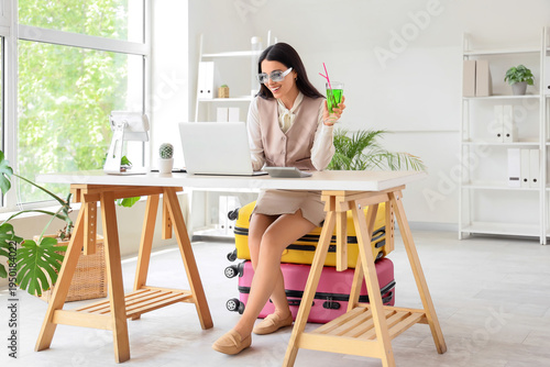 Young businesswoman with co...