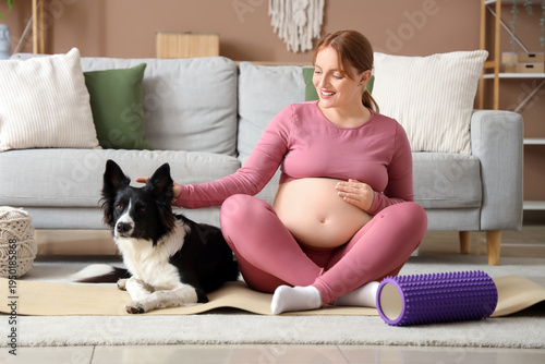 Sporty young pregnant woman...