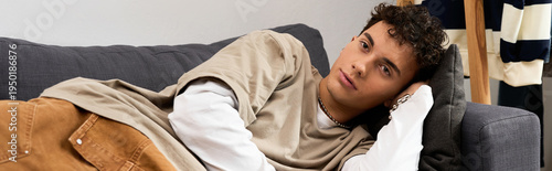 Stylish teenager relaxing at home with a laid back attitude and modern vibe