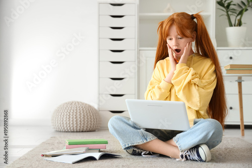 Surprised little redhead gi...