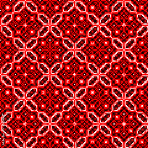 Seamless Ukrainian embroidery vector pattern inspired by traditional vyshyvanka ornament. Ethnic geometric folk design made in cross stitch style with red and black stitches