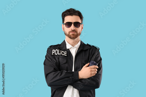 Male police officer with ra...