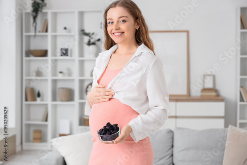 Young pregnant woman with d...