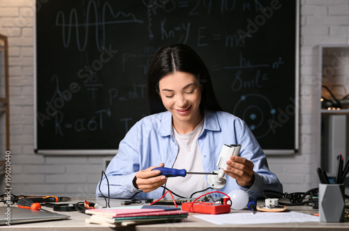 Female inventor making devi...