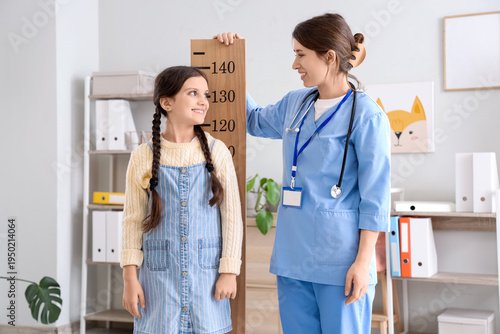 Female pediatrician with st...