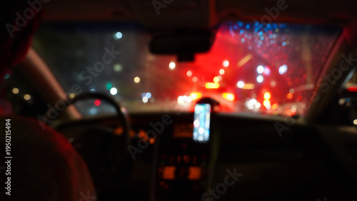 Rainy Night Traffic with Bokeh Lights Viewed from Car Interior