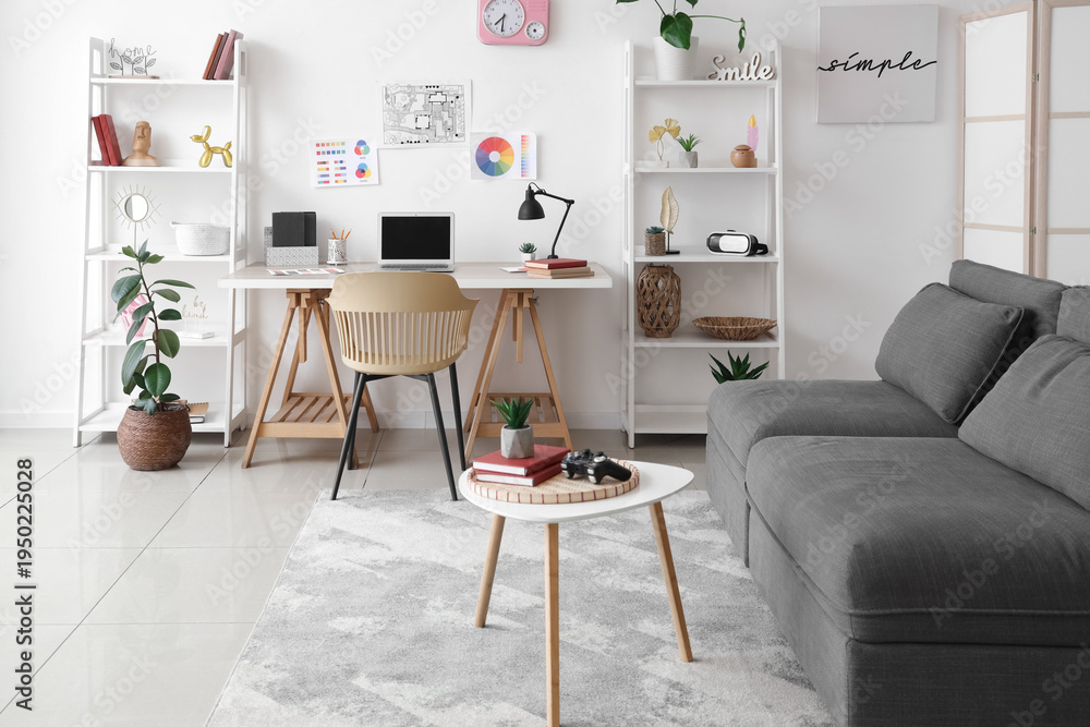 Fototapeta premium Interior of living room with workplace, sofa and shelf units