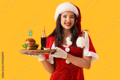 Pretty young woman in Santa...