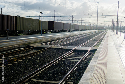 Bild auf Leinwand freight train cargo containers texture background railway station perspective in