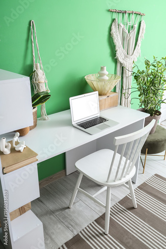 Modern table with laptop ne...