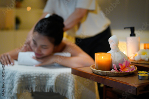 Fotografie Aromatherapy massage ambiance or spa salon composition setup, focus decor candle