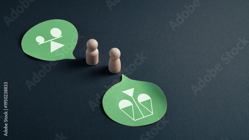 Business negotiation and balance concept with wooden figures and scale icons in speech bubbles