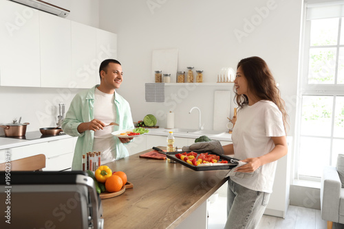 Young couple cooking health...
