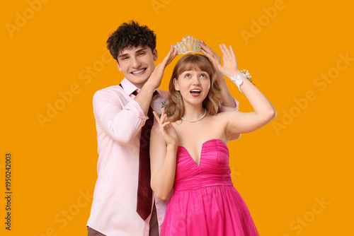 Young boy crowning his prom...