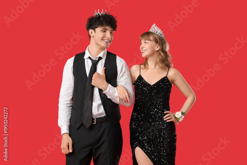 Happy prom couple with crow...