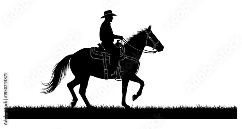 Silhouette of a cowboy riding a horse across grassy plains