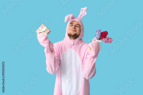 Young man in bunny costume ...