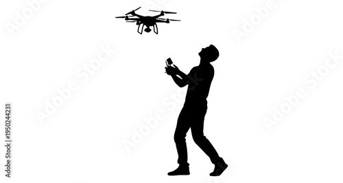 Silhouette of a man operating a drone with a remote control