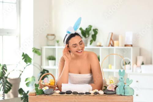 Young woman with bunny ears...