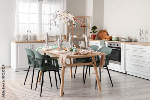 Beautiful table setting for Easter celebration in kitchen