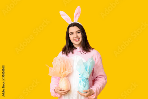 Happy young woman in bunny ...