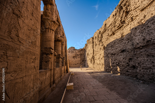 Ancient hieroglyphic wall and columns at Medinet Habu temple