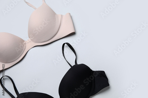 Stylish female bras on grey...