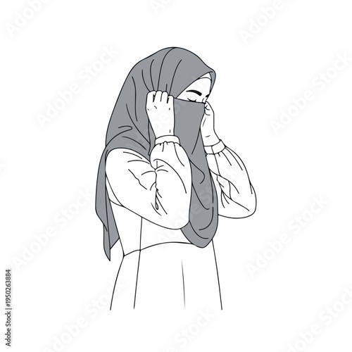 Woman wearing hijab adjusting her face covering