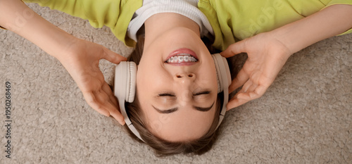 Young woman in headphones w...