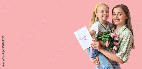Cute little girl greeting her mom for Mother's Day with tulips and greeting card on pink background with space for text