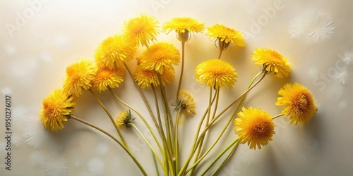A vibrant bouquet of bright yellow dandelions arranged artfully against a soft, light background, capturing the essence of springtime freshness and natural beauty.