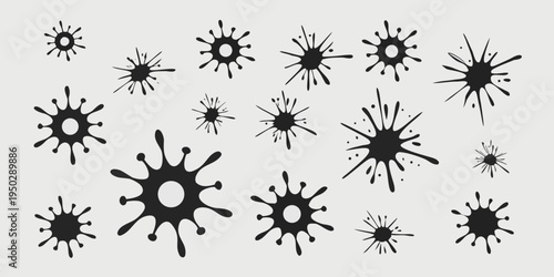 Black ink splatters in various sizes and shapes