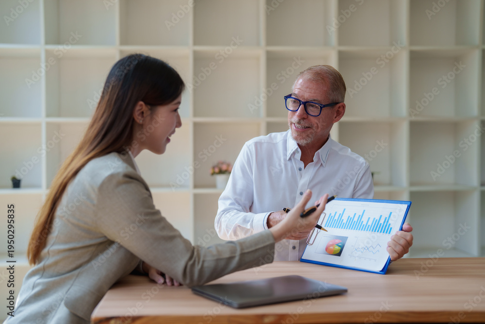 © Tj - Business people discussing financial data and analyzing growth © Tj - Business people discussing financial data and analyzing growth