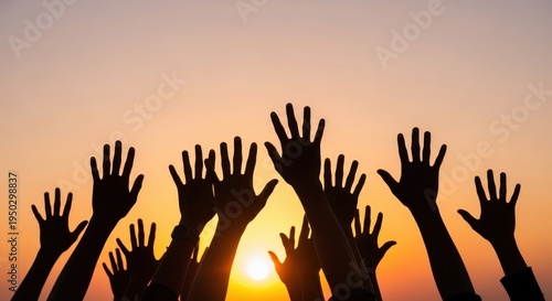 A group of people reaching their hands toward the bright sun during a beautiful golden sunset time
