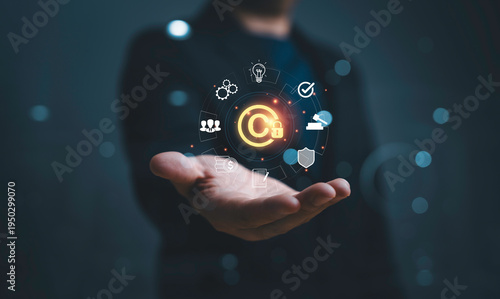Businessman holding copyright symbol represent intellectual property protection, copyright monitoring, digital rights management, legal compliance and content ownership security.