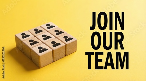 Recruitment concept with wooden blocks and join our team text on yellow background.